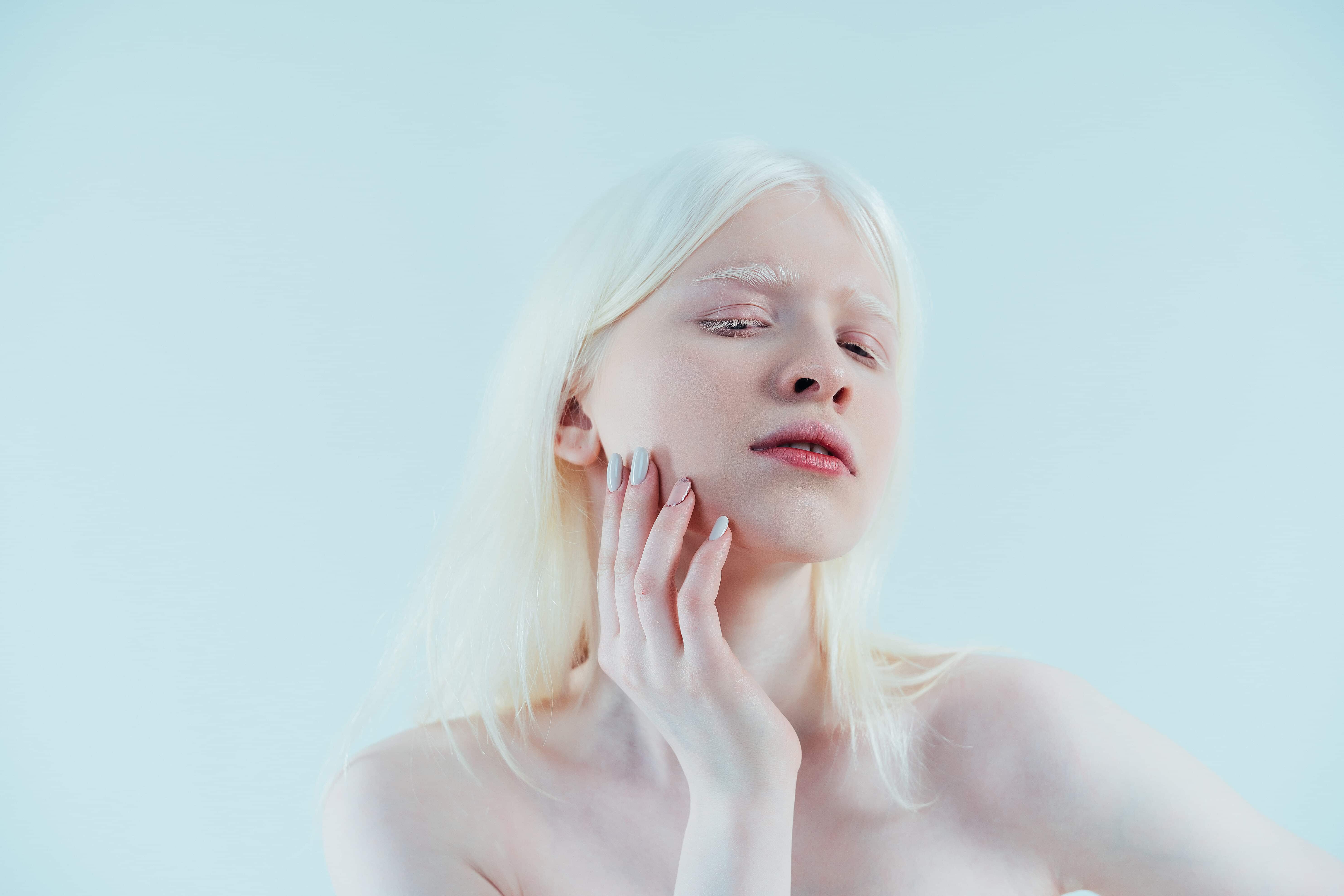Beauty image of an albino girl posing in studio  body positivity, diversity, and fashion