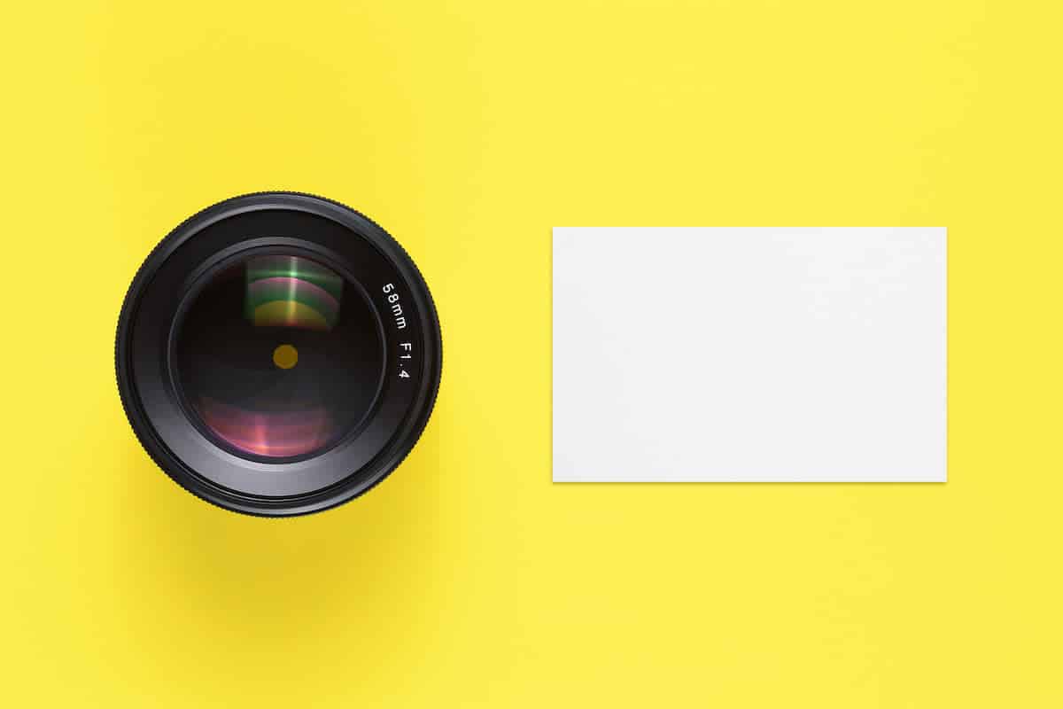 business-card-mock-up-and-camera-lens-top-view-A657UXK