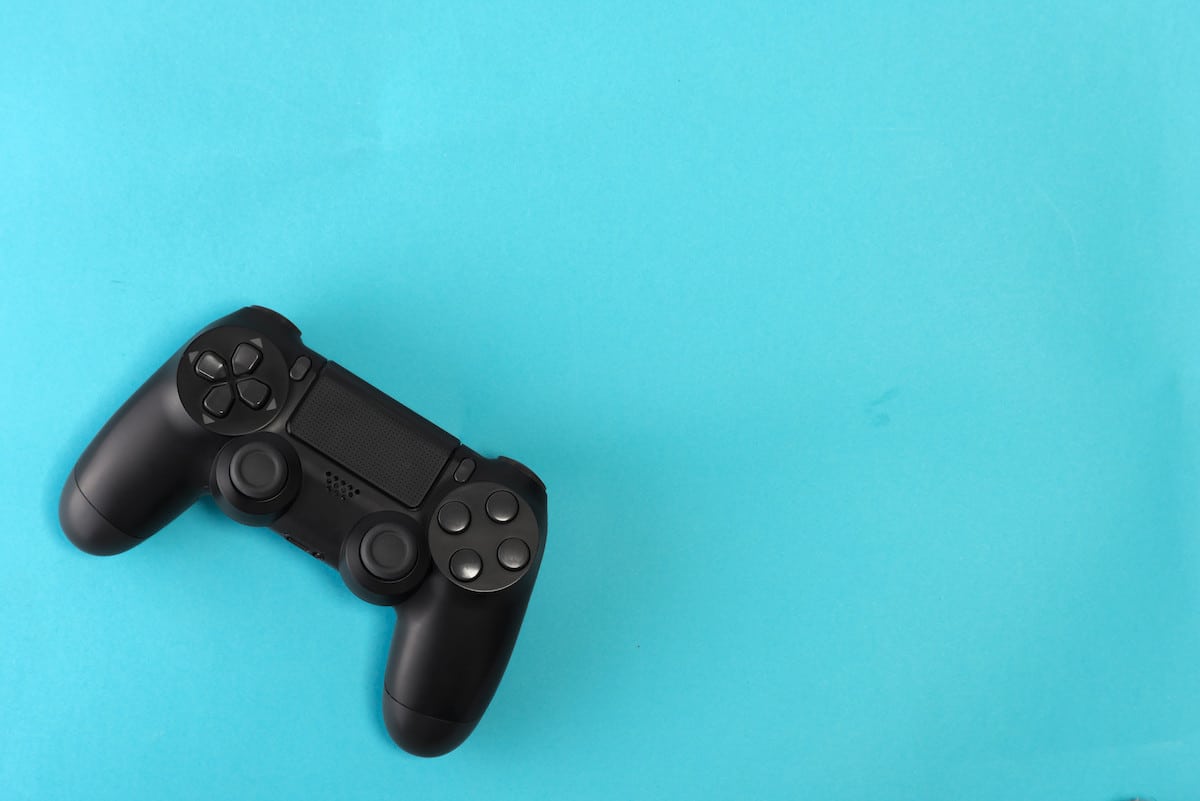 game-controller-on-blue-background-studio-shot-PT5WPGB