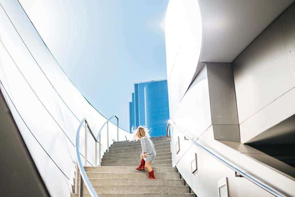 girl climbing up stairs photo composition