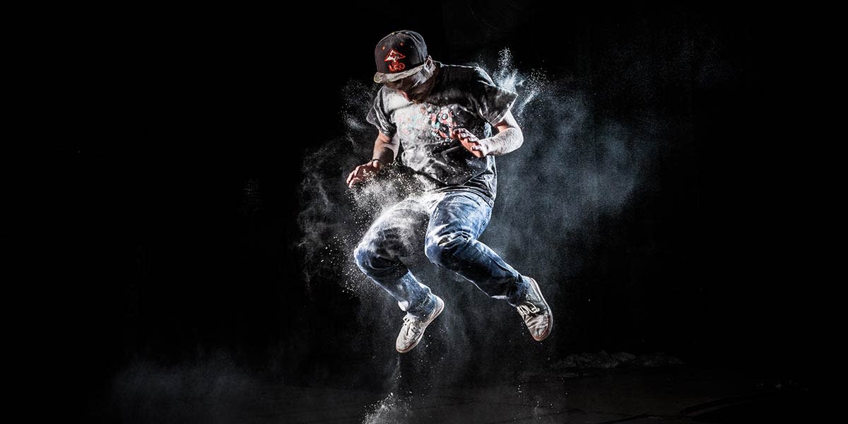 man-jumping-in-white-powder-flash-photography