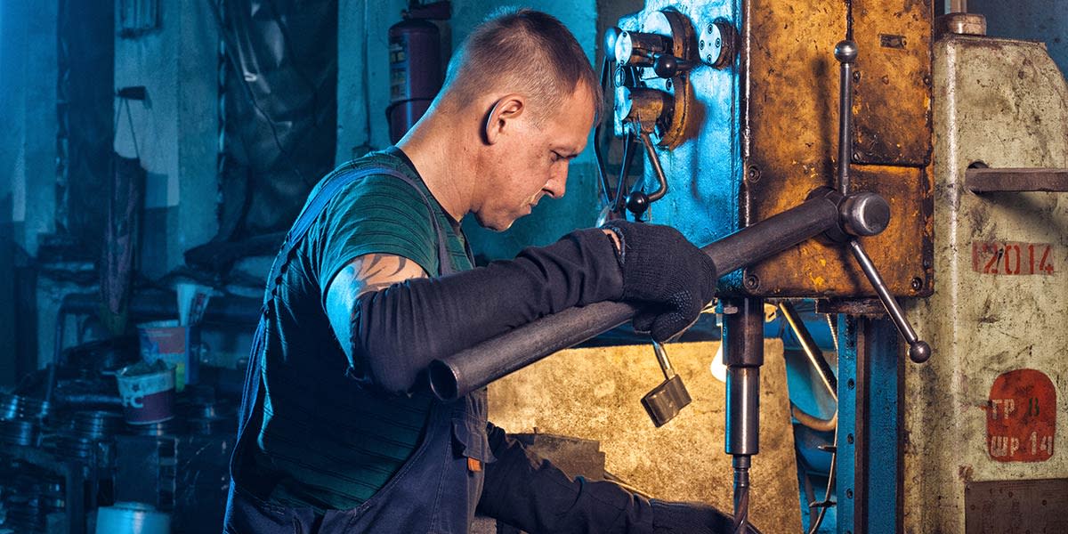 man-working-in-a-machine-shop-with-off-camera-lighting