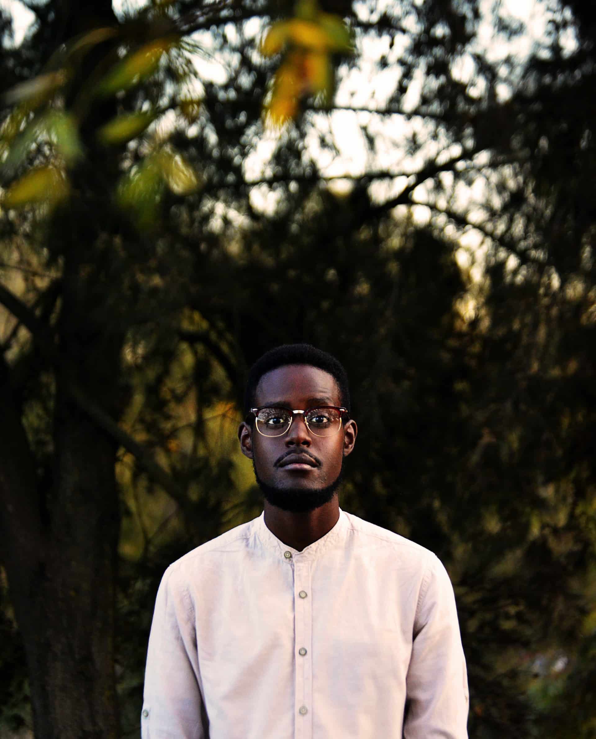 man standing in woods