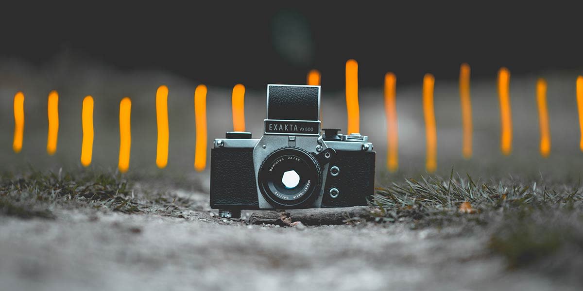 old-slr-camera-with-out-of-focus-background