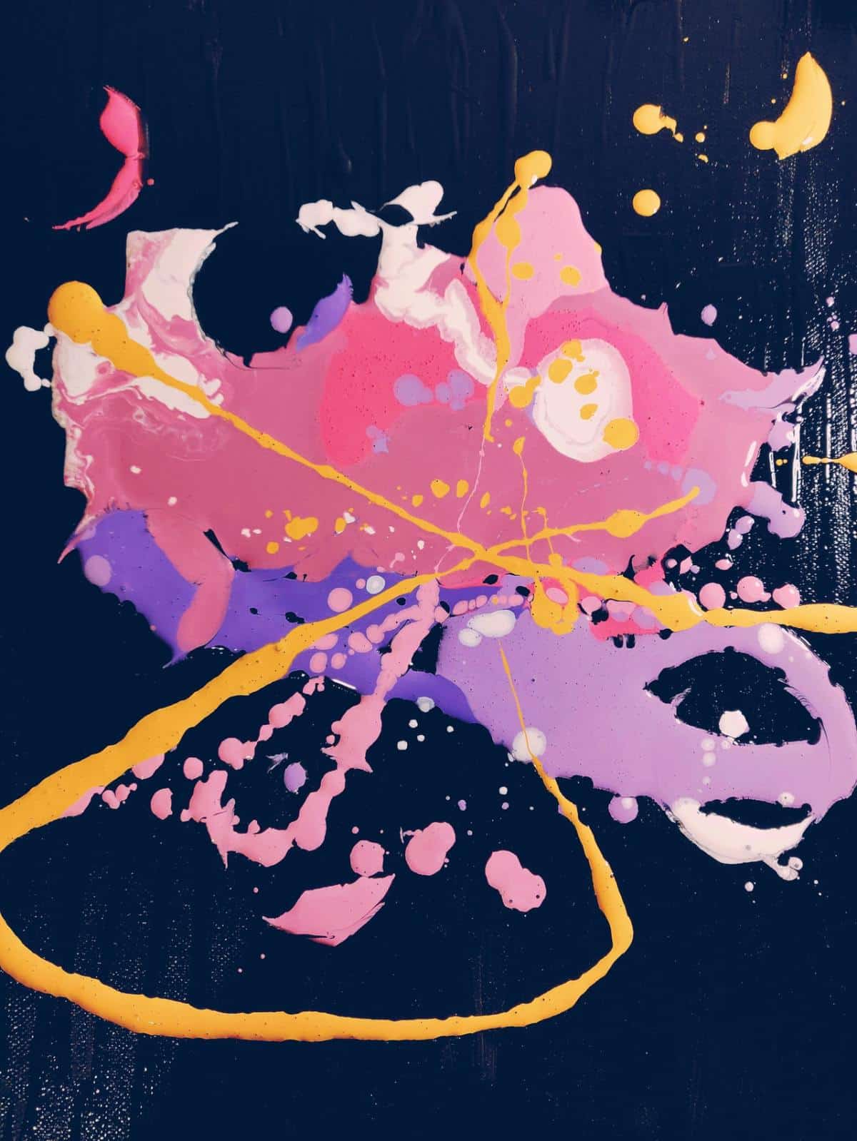 Ink splatters in pink yellow and purple