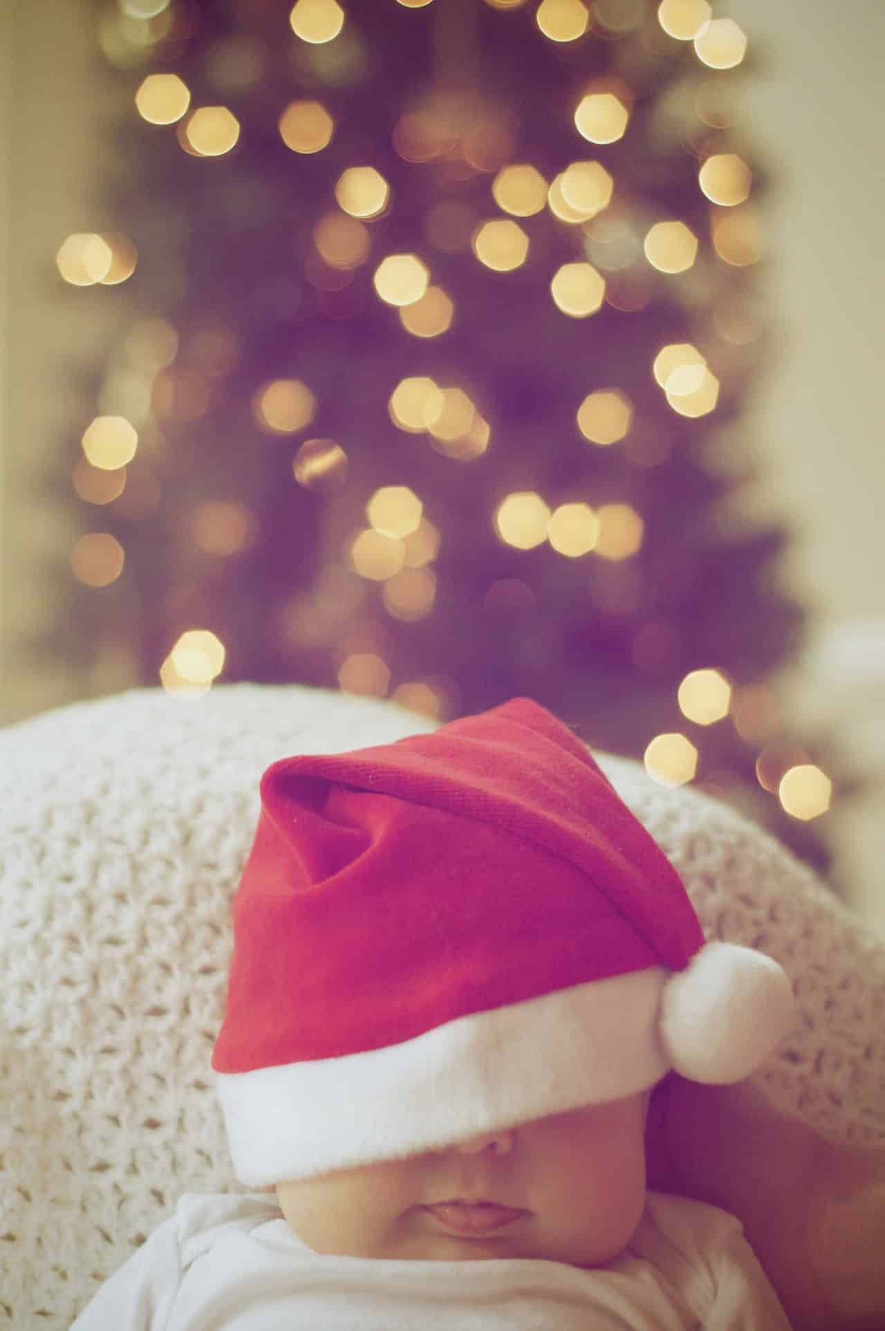 Sleeping baby in christmas hat