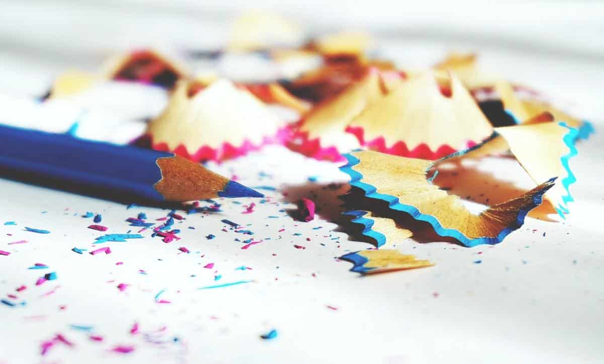 blue pencil crayon and sharpener shavings