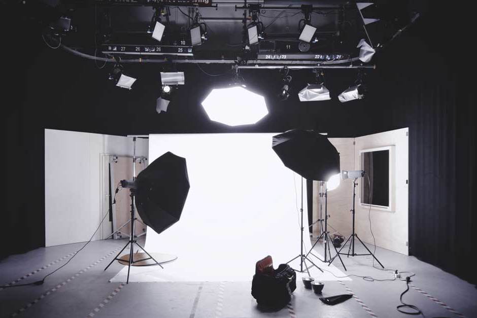 photography studio with white backdrop and softbox lights