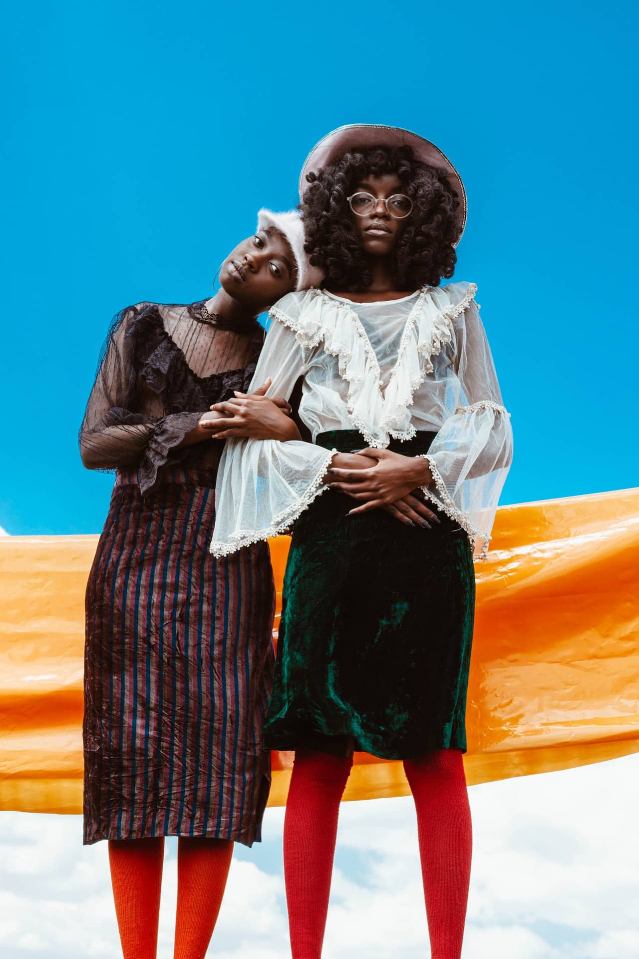 two woman in fashionable clothes