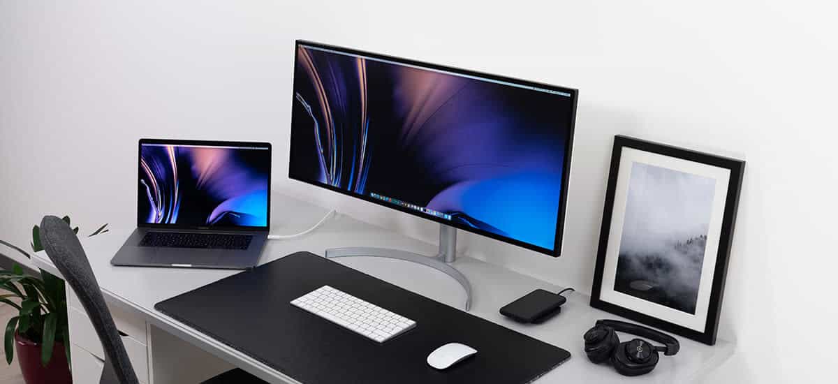 wide-screen-monitor-on-white-desk