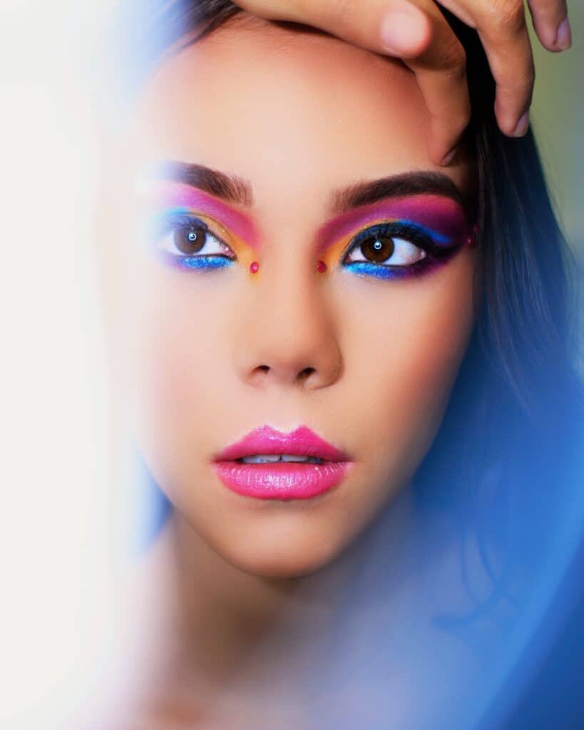 woman with colorful eye makeup and lips